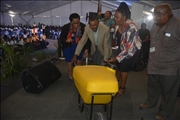 DM handing over water trolleys at the event attended